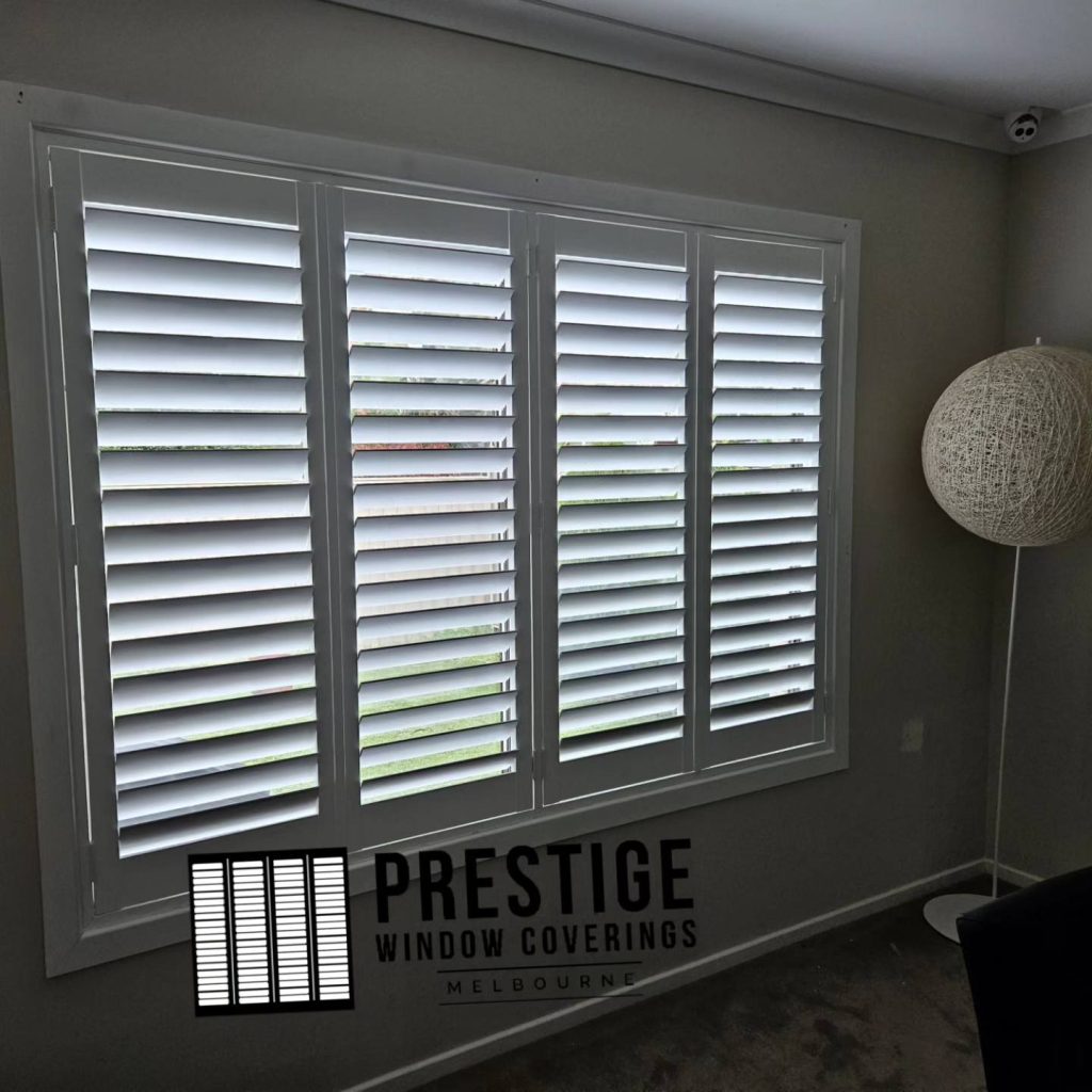 White plantation shutters installed in Rye living area