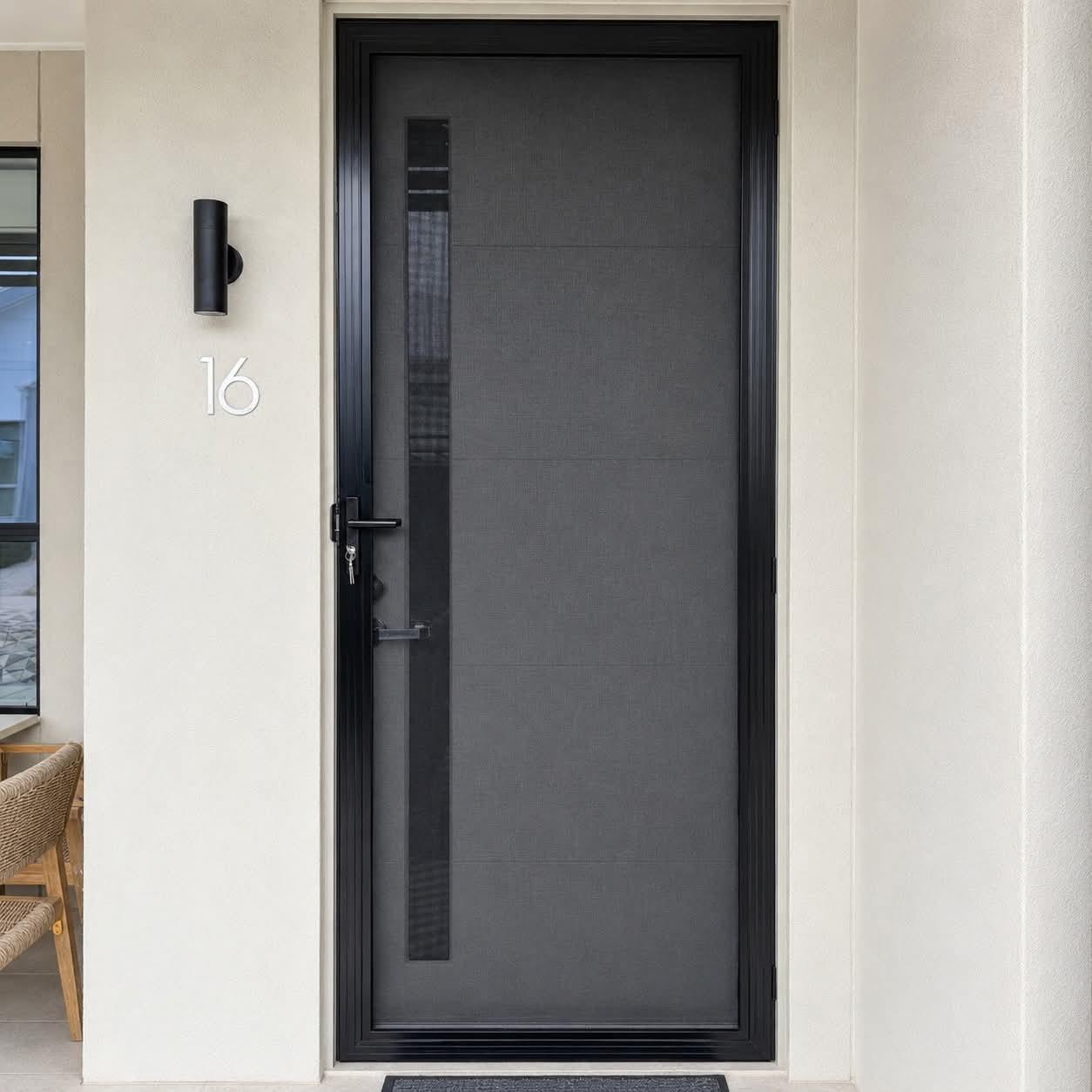 Modern grey front door with a narrow vertical glass panel